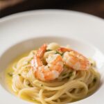 Garlic butter shrimp pasta served on ceramic plate