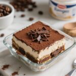 Rich and creamy chocolate tiramisu topped with cocoa powder