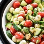 fresh cucumber caprese salad with mozzarella and tomatoes