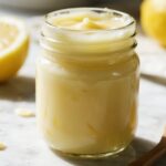 Homemade Italian Lemon Spread Delight in mason jar with lemon and spoon